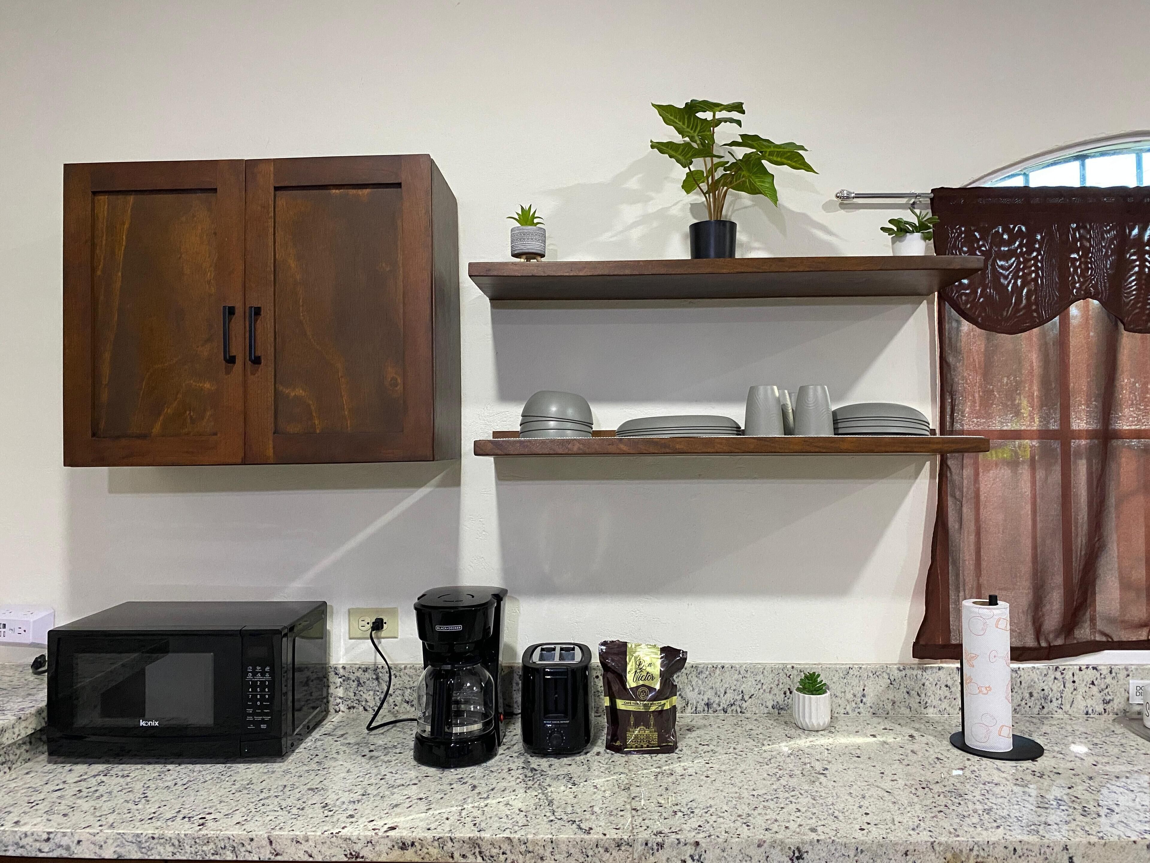 Full-size fridge, microwave, stovetop, cookware/dishes/utensils