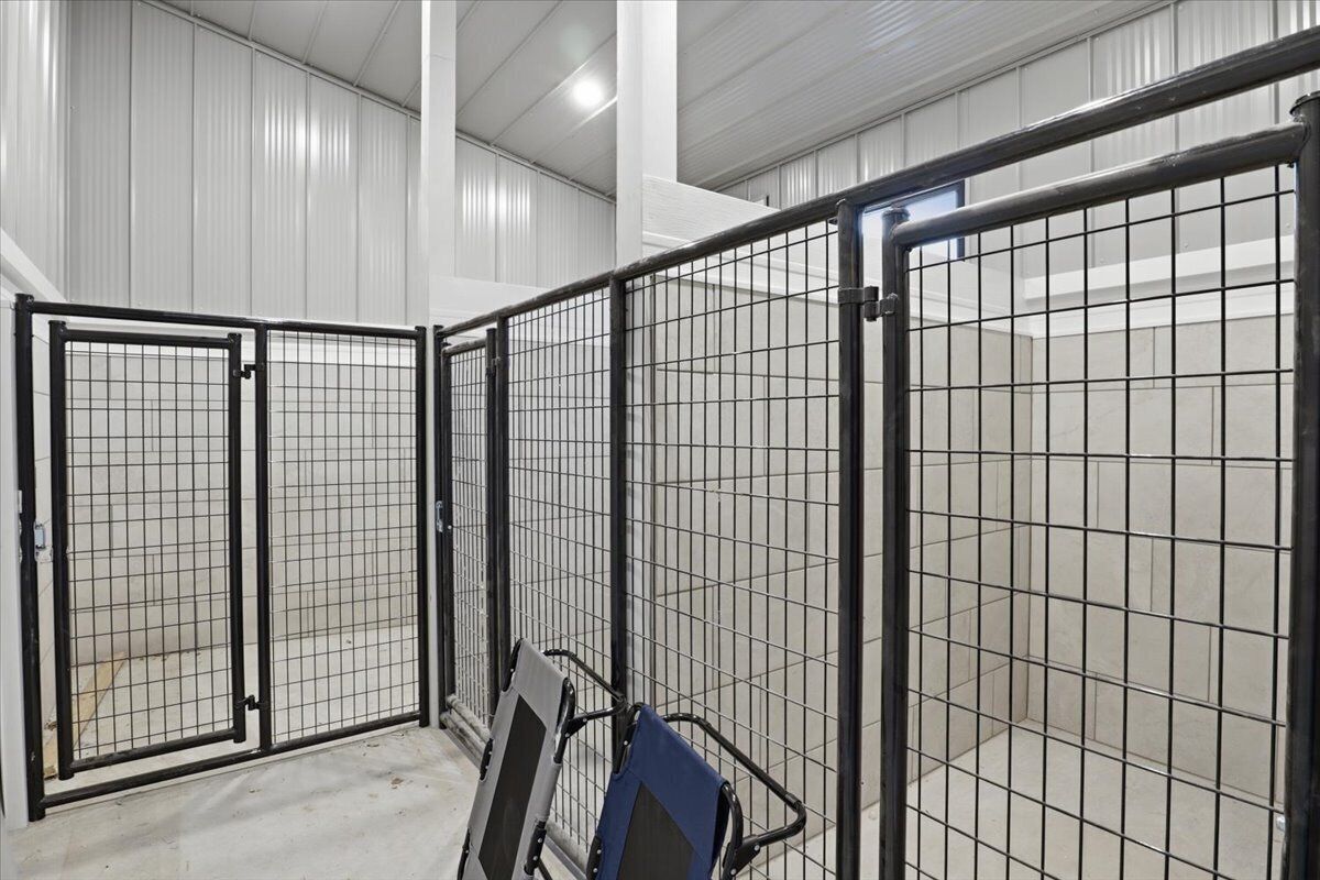 A metal gate with a grid pattern, a metal frame, and a metal door.