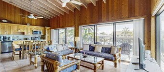 Charming canal-front home with 37-ft dock, kayaks, grill, patio & club access