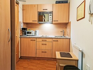 Fridge, microwave, cookware/dishes/utensils