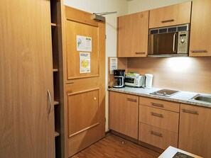 Fridge, microwave, cookware/dishes/utensils