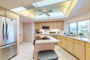 Fridge, microwave, oven, stovetop - Waterfront home with pool, dock accessible to Gulf, dog friendly with AC & WD (Osprey)