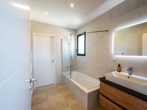 Shower, hair dryer, towels, toilet paper