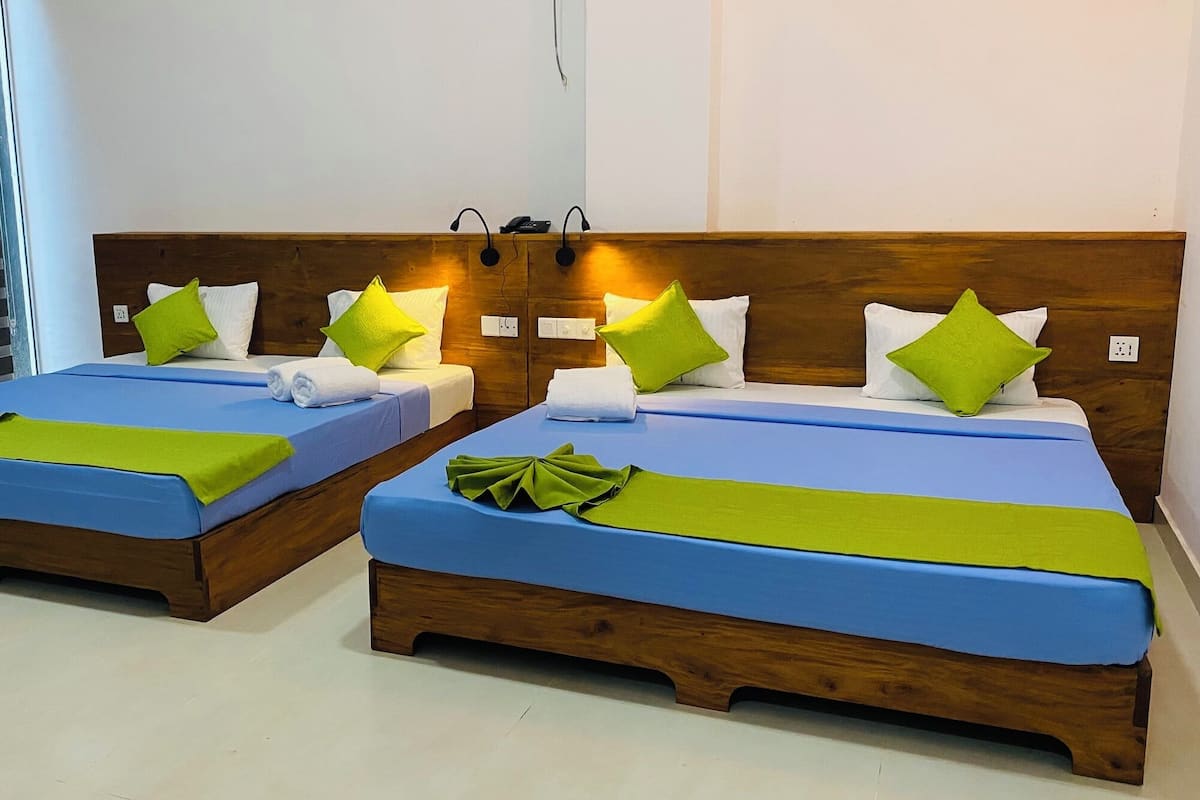 Junior Quadruple Room | 1 bedroom, in-room safe, desk, laptop workspace