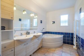 Shower, hair dryer, towels, toilet paper