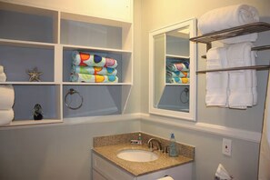 Shower, hair dryer, towels