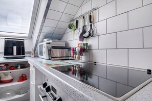 Coffee/tea maker, fridge, microwave, oven