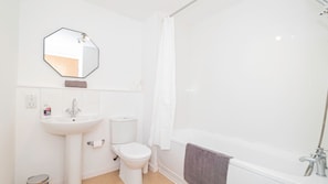 Shower, hair dryer, towels, shampoo