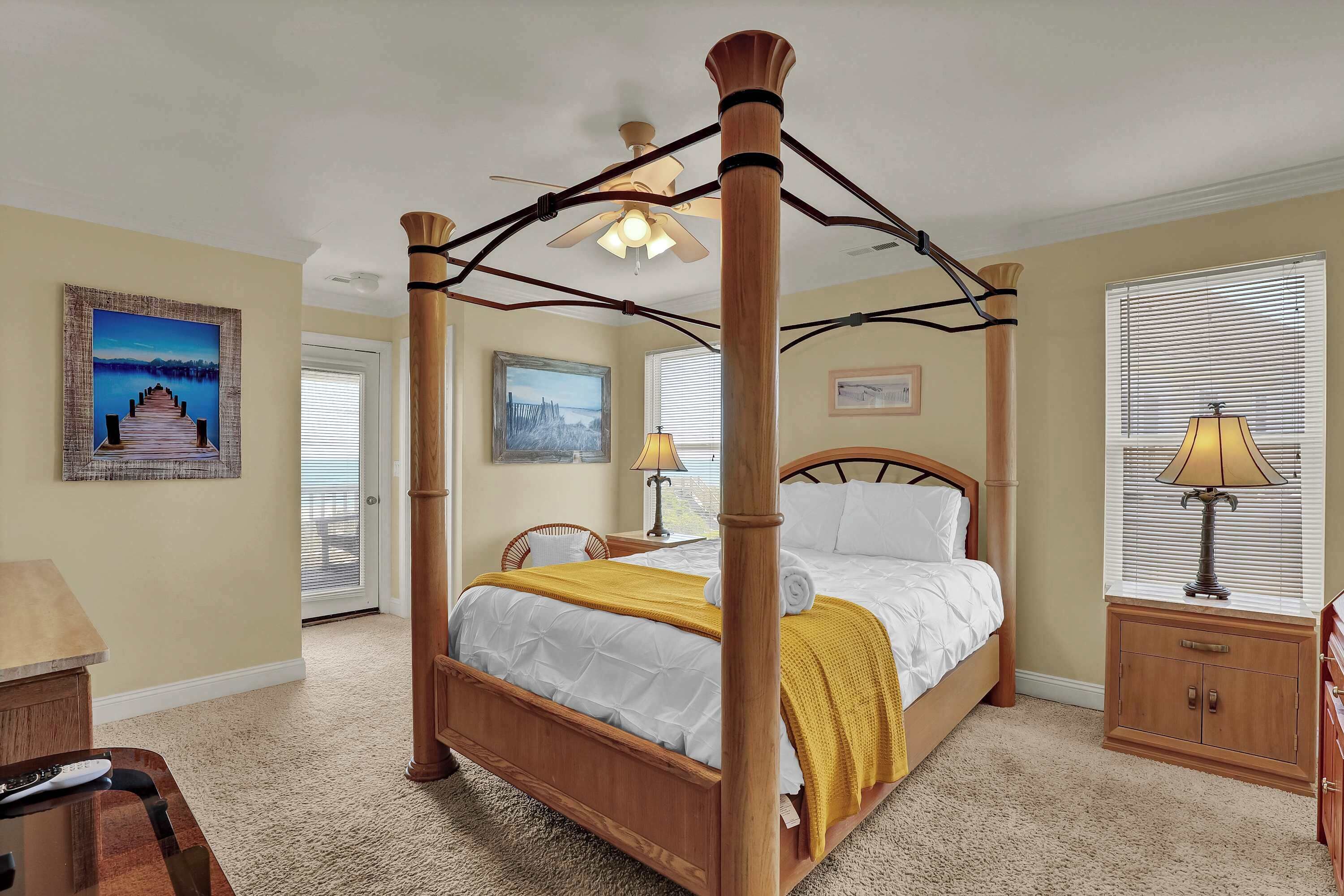 Bright, cheerful, and welcoming—this cozy bedroom is perfect for a restful night after a day in the sun.