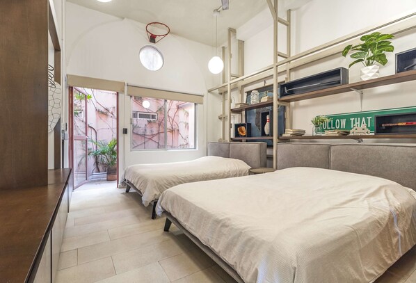 1 bedroom, desk, iron/ironing board, travel crib