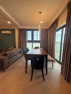 Condo, Balcony, City View | Living area - Kinville  Suites - Cantonment Living (Accra)