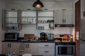 Fridge, microwave, stovetop, coffee/tea maker