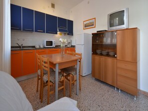 Fridge, microwave, coffee/tea maker, cookware/dishes/utensils