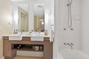 Shower, hair dryer, towels, shampoo