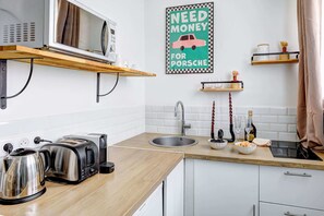 Fridge, microwave, stovetop, coffee/tea maker