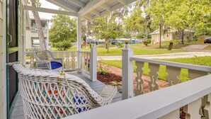 A covered porch with wicker chairs and a view of a residential street. - 1 Block to Crescent Lake: Charming Home w/ Porch! (Crescent City)