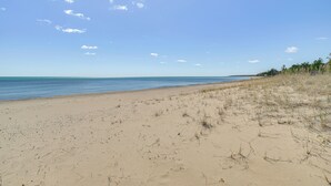 A beach with a clear sky and calm sea. - Private Beach: Waterfront Home on Lake Huron! (Greenbush)