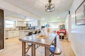 Enjoy cooking in this well-equipped kitchen with a central island, sink, stove, and ample counter space.