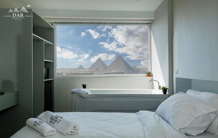 Deluxe Room, Mountain View | Minibar, in-room safe, blackout drapes, soundproofing