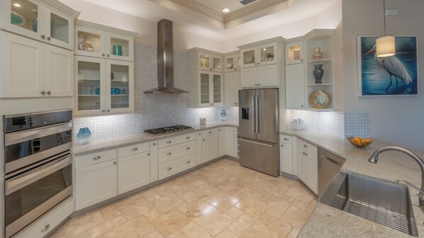 Fridge, oven, coffee/tea maker, cookware/dishes/utensils