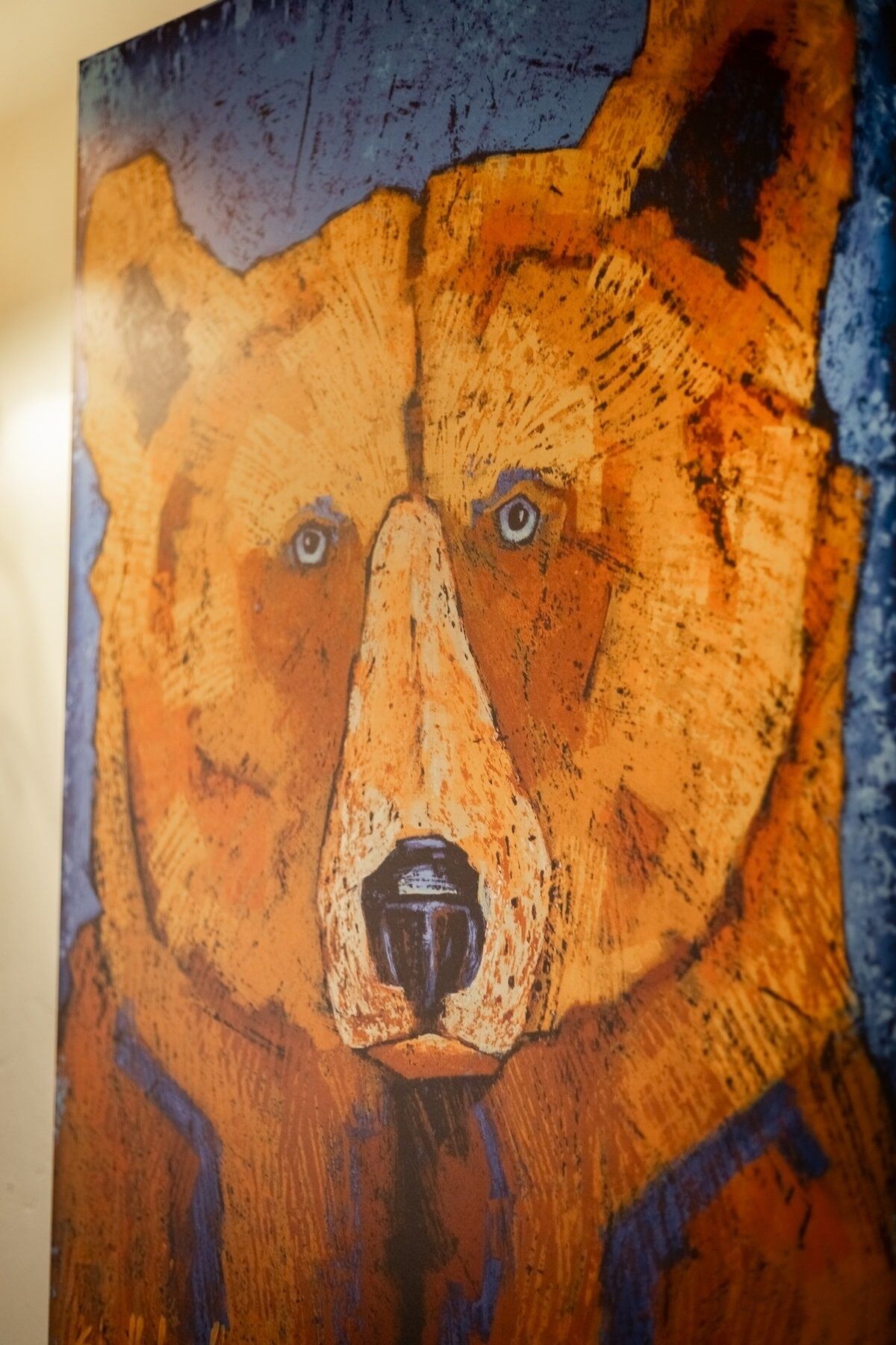 A close-up of a textured artwork with abstract patterns and shapes.