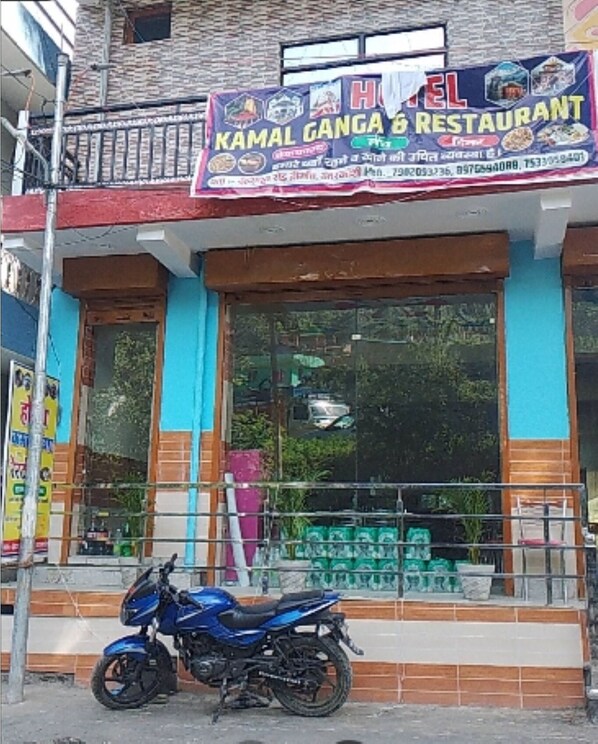A hotel named "Kamal Gang" with a signboard advertising the establishment. - Hotel Kamal Ganga & Restaurant (Rajgarhi)