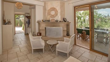 Family Apartment, 3 Bedrooms, Garden View | Living area | 40-inch flat-screen TV with digital channels