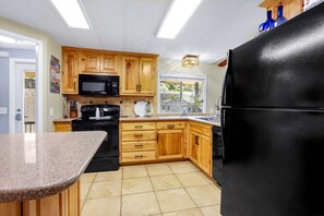 The inviting kitchen offers ample space & every home comfort - Lakefront Daze – Stay for 6 w/ Pool Table & Outdoor Oasis (New Braunfels)