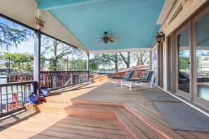 Lounge the day away with gorgeous water views on the back deck - Lakefront Daze – Stay for 6 w/ Pool Table & Outdoor Oasis (New Braunfels)