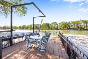 Enjoy meals by the water’s edge on the upper deck! - Lakefront Daze – Stay for 6 w/ Pool Table & Outdoor Oasis (New Braunfels)