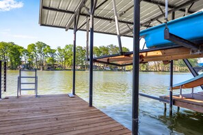 Head to the dock to enjoy waterside serenity or adventures on the lake - Lakefront Daze – Stay for 6 w/ Pool Table & Outdoor Oasis (New Braunfels)
