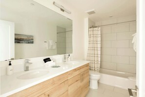 Shower, hair dryer, towels, shampoo