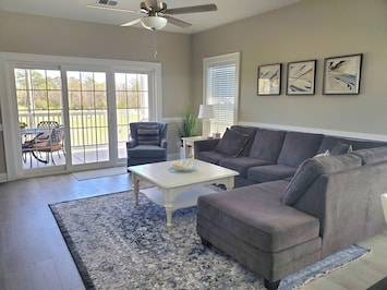 Spacious Living Room with Access to Balcony