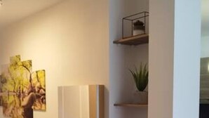 A hallway with a wooden bench, a wall-mounted cabinet, and shelves with plants. - Between lake and mountains, L'ange des Cimes welcomes you to Savines-le-Lac (Savines-le-Lac)