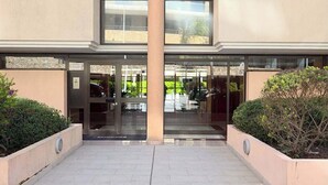 A hotel entrance with a glass door, a sign reading "Residence Eugenia," and a paved walkway. - LX146 - Studio cosy avec balcon & vue mer - Monaco (Beausoleil)