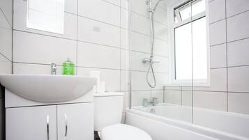 Shower, hair dryer, towels