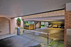 Secure parking available for guests, with a gated entrance and multi-level underground parking structure.