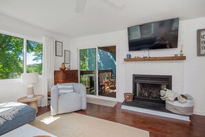 TV, fireplace - Dunes & Drives: 2 Community Pools, Tree-lined Street, Close to Ocean (Oak Island)