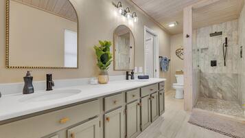 Shower, hair dryer, towels, toilet paper