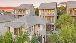A residential building with multiple balconies and a covered patio area. - North Winston Villa|Easy Beach Access|Private Pool & Golf Cart (Inlet Beach)