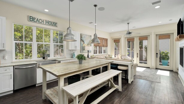 A spacious kitchen with a large island, pendant lights, and a ceiling fan. - North Winston Villa|Easy Beach Access|Private Pool & Golf Cart (Inlet Beach)