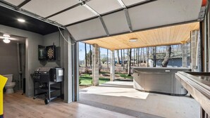 A modern kitchen with a wooden countertop and a built-in oven.