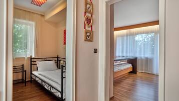 Comfort Triple Room, Lanai, Mountain View | In-room safe, desk, laptop workspace, blackout drapes