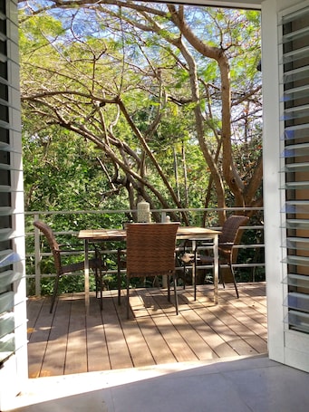 Outdoor dining. 2 Bedroom 1 1/2 Bath Charming In Town Apartment with Great Jungle View Deck!