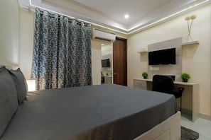Desk, laptop workspace, blackout curtains, free WiFi