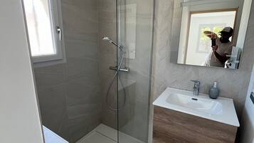 Shower, hair dryer, towels, soap