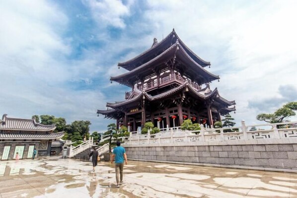 A traditional Chinese building with multiple tiers and ornate roof structures. - Dong'an Business Hotel (Guilin University of Technology Pingfeng Campus Branch) (Guilin)