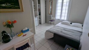 1 bedroom, desk, iron/ironing board, travel crib