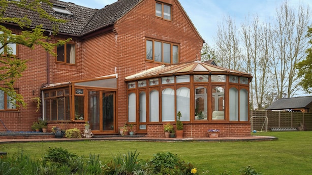 A brick house with a conservatory, a lawn, and a garden. - Idyllic views, yet close to amenities and places of interest to explore. (Flordon)