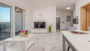 A modern apartment with a living area, dining space, and kitchen. - 2 bedroom amazing apartment in Povljana (Povljana)